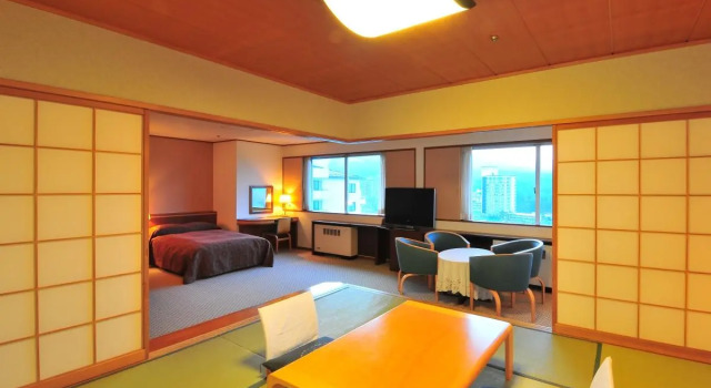 Кровать в общем номере KAMENOI HOTEL Kusatsu Resort