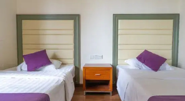 Кровать в общем номере с 3 комнатами Fengfan Resort Apartment (Zhapo Dajiaowan Water Park)