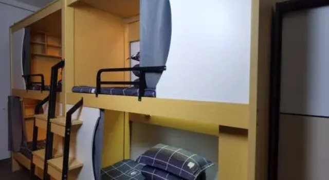 Кровать в общем номере Aidu Hotel Apartment