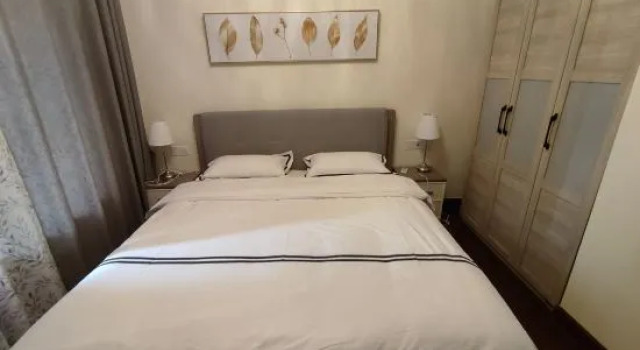 Кровать в общем номере с 3 комнатами Qidong Henghai Coast Apartment