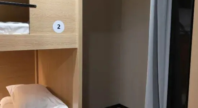 Pat în dormitor (dormitor pentru bărbați) Guanwo Hostel