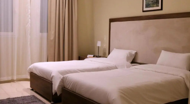 Vuode makuusalissa Qatar Youth Hostels