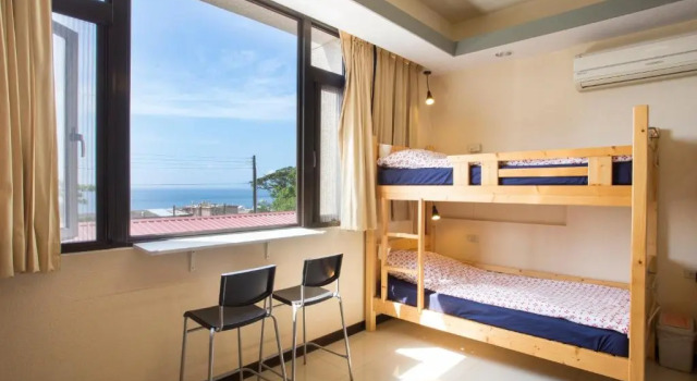Кровать в общем номере Dali Yi International Hostel