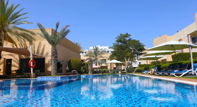 Кровать в общем номере Coral Boutique Villas