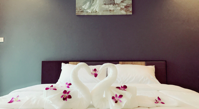 Кровать в общем номере Supachai Inn
