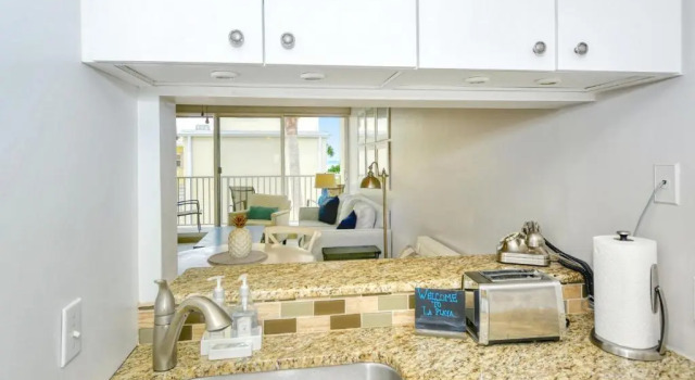 LaPlaya 202E Catch the gentle Gulf breezes on your private balcony beneath the swaying palms