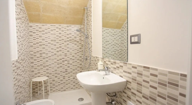 Cama en dormitorio compartido familiar Ostello dei Sassi - Matera Hostels