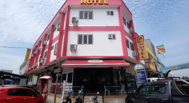 Кровать в общем номере OYO 1104 Q Hotel