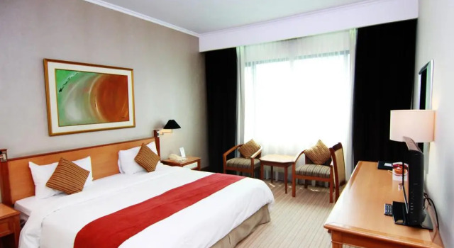 Номер Deluxe Menara Peninsula Hotel