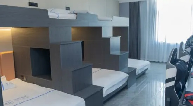 Кровать в общем номере Boya Esports Hotel
