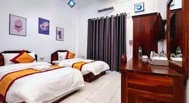 Кровать в общем номере Vang Vieng Family Boutique Hotel