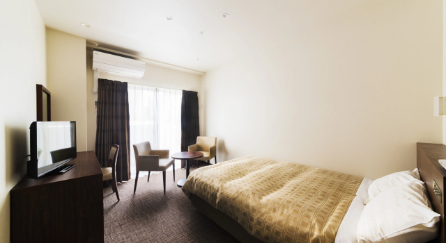 Кровать в общем номере (женский номер) Kanku Izumisano First Hotel