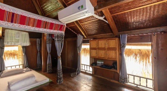 Кровать в общем номере EBINO PULUONG RESORT and SPA