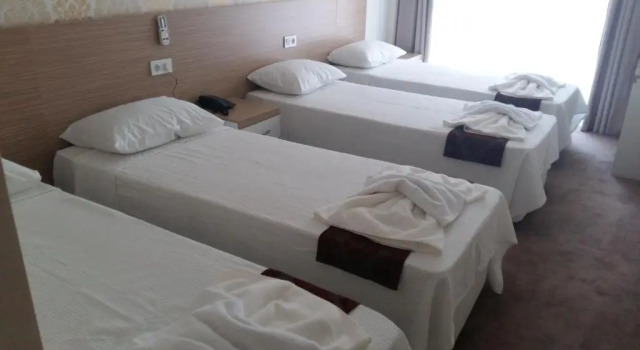 Кровать в общем номере Nicea Hotel