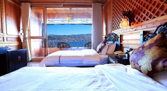 Lugu Lake Mosuo Park Hotel, Prenota Hotel Hotel a Ninglang con parcheggio, Parcheggio