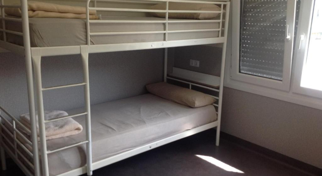 Кровать в общем номере Albergue As Eiras
