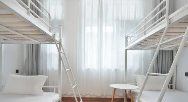 Кровать в общем номере Sanchen XiaoyangBuilding Homestay