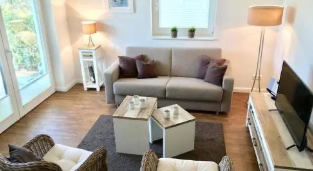 Ferienwohnung Dünenhäuser App. A2, Забронировать Отель Шарбойц Holstein Switzerland, рядом с Пляж Hundestrand