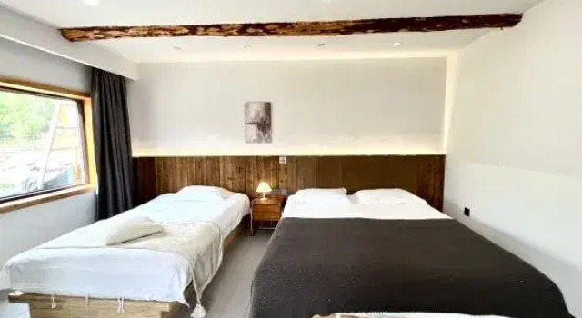 Кровать в общем номере Hemu | A garden Full of Stars • Big Bear Cabin • Scenic Boutique Stay (Yuanjiang Bridge)