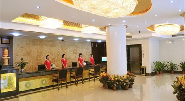 Кровать в общем номере Junshan Hotel