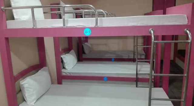 Кровать в общем номере DUDI HOTEL