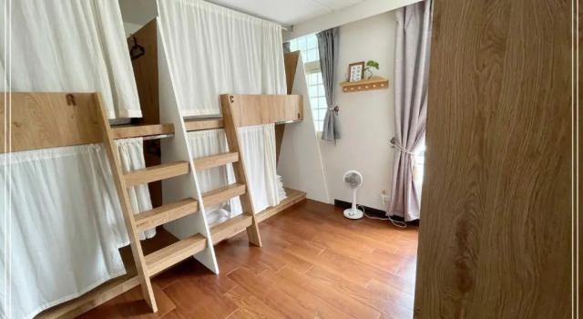 Кровать в общем номере Green Park Homestay