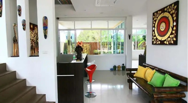 Кровать в общем номере Nicha Residence