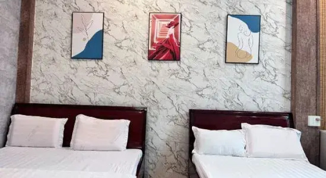 Кровать в общем номере Trung Hau Hotel