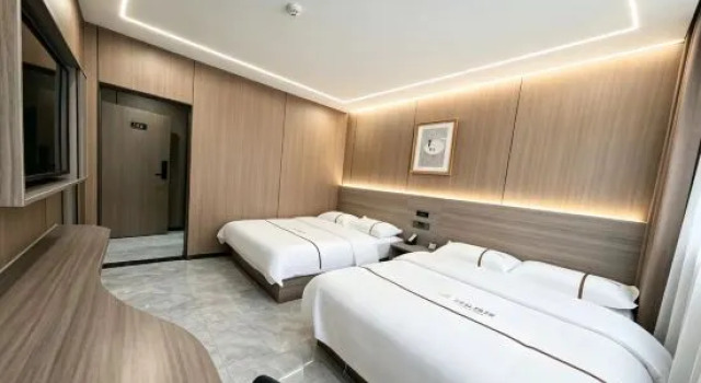Кровать в общем номере Aershan Yixuan Hotel (Wuliquan Branch)