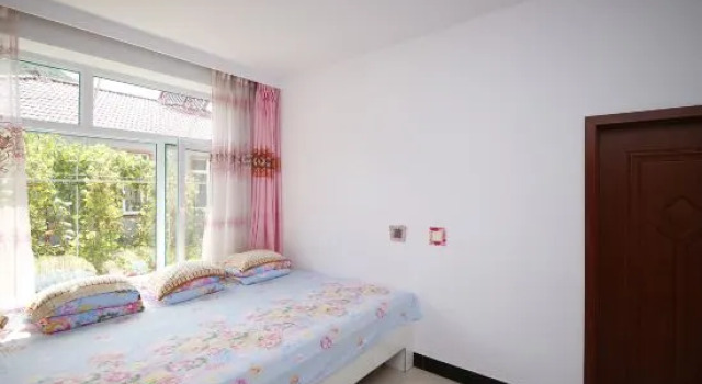 Кровать в общем номере Xuanxiangyuan Farm Stay