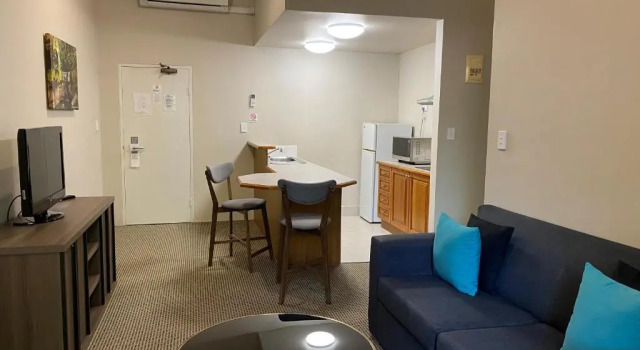Апартаменты The Belmore Apartments Hotel