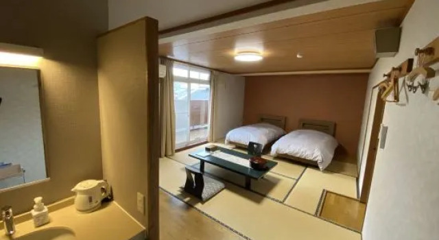 Кровать в общем номере Japanese Auberge Matsu-tsuru