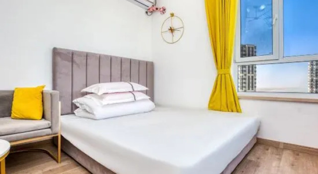 Люкс с 2 комнатами с видом на море Yingkou Vanke Letu Seaview Apartment