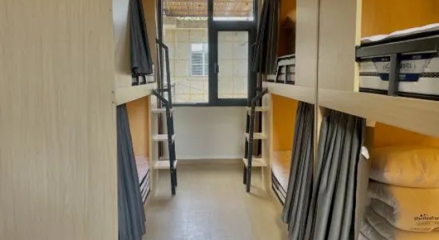 Кровать в общем номере (женский номер) Mangshi Lilian Youth Hostel