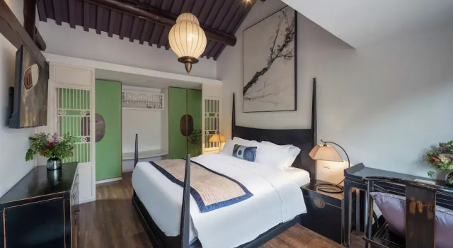 Кровать в общем номере Beijing Lezai Nanluo Countyard Hotel