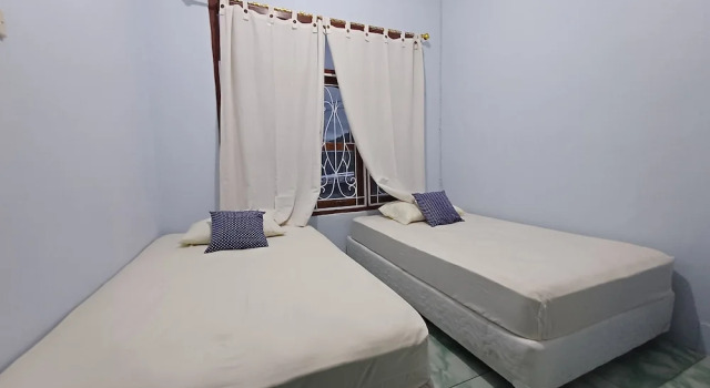Номер Economy Komodo Indah Hotel