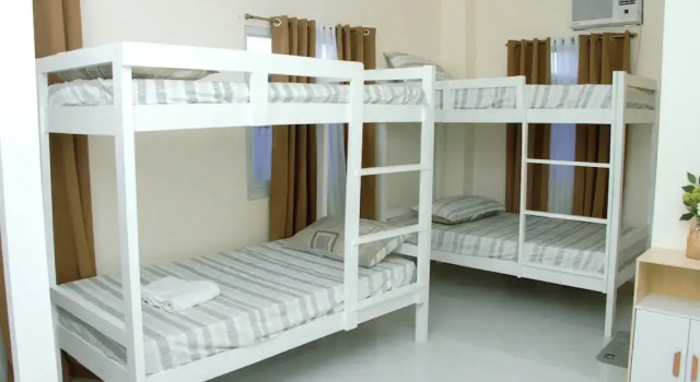 Кровать в общем номере Amar Residence
