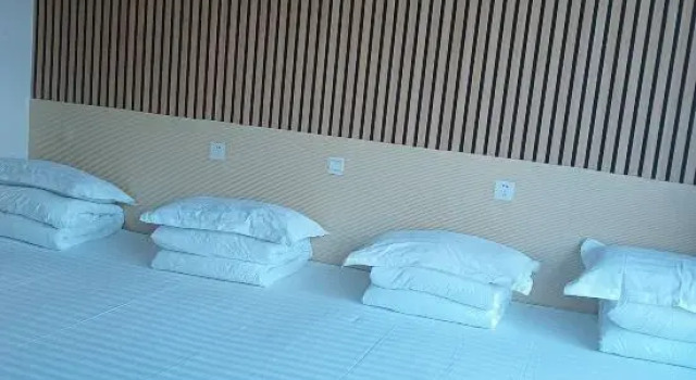 Кровать в общем номере Badaling Ruifangju Homestay