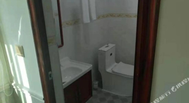 yongxingloulvguan, Boek Hotel Wanning Hainan