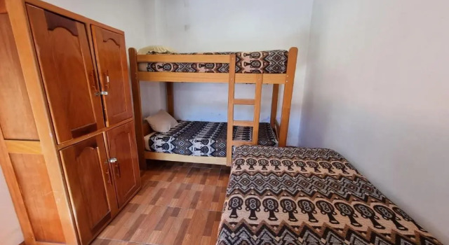 Łóżko w pokoju wieloosobowym Chelitos Backpacker