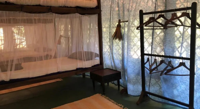 Кровать в общем номере Bhakti Kutir