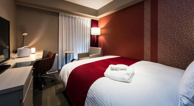 Кровать в общем номере (женский номер) Daiwa Roynet Hotel Kokura Ekimae