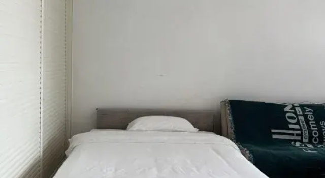 Кровать в общем номере с видом на море Haikou Bella Smart Apartment (International Convention and Exhibition Center Mengxiang Longteng Bay)