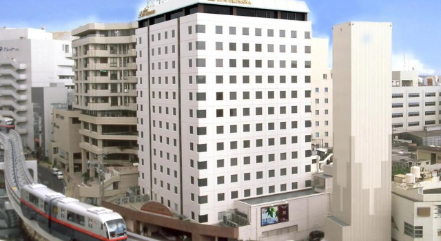Кровать в общем номере Hotel Sun Okinawa