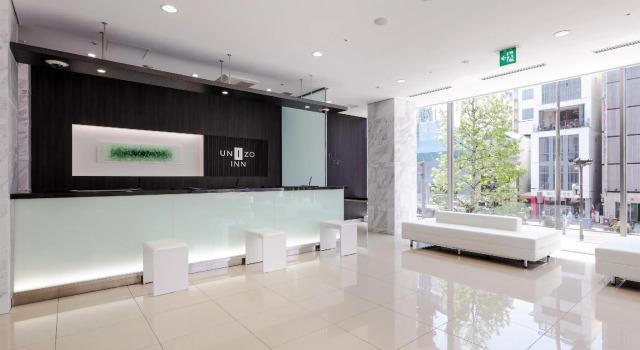 Кровать в общем номере Unizo Inn Nagoya Sakae