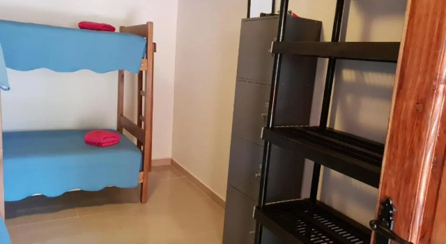 Кровать в общем номере Portal Andino Lodge