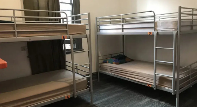 Cama en dormitorio compartido Haus Accommodation