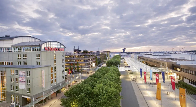Кровать в общем номере Mövenpick Hotel Nürnberg Airport