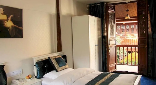 Lijiang 49 Sakura Hotel, Забронировать Отель Лицзян Юньнань, рядом с Улица Сквер-стрит Древнего города Даянь