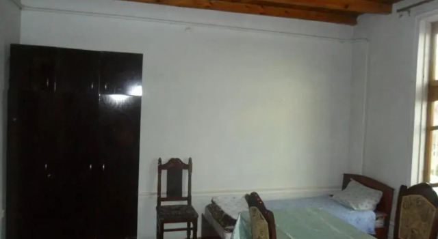 Cama en dormitorio compartido B&B Bahodir
